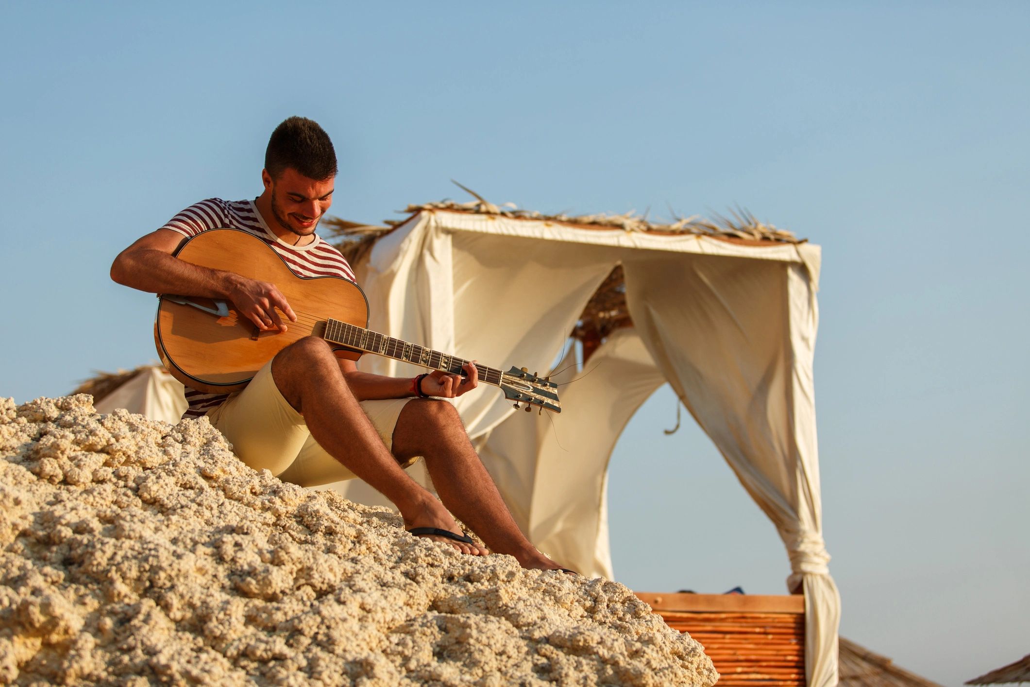 Acoustic guitarist performing outdoors